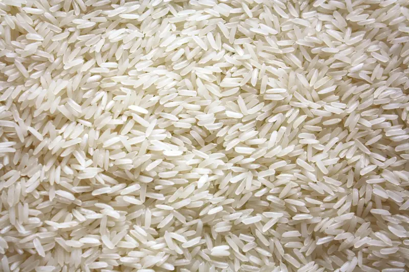 Macro close-up of a pile of white rice grains